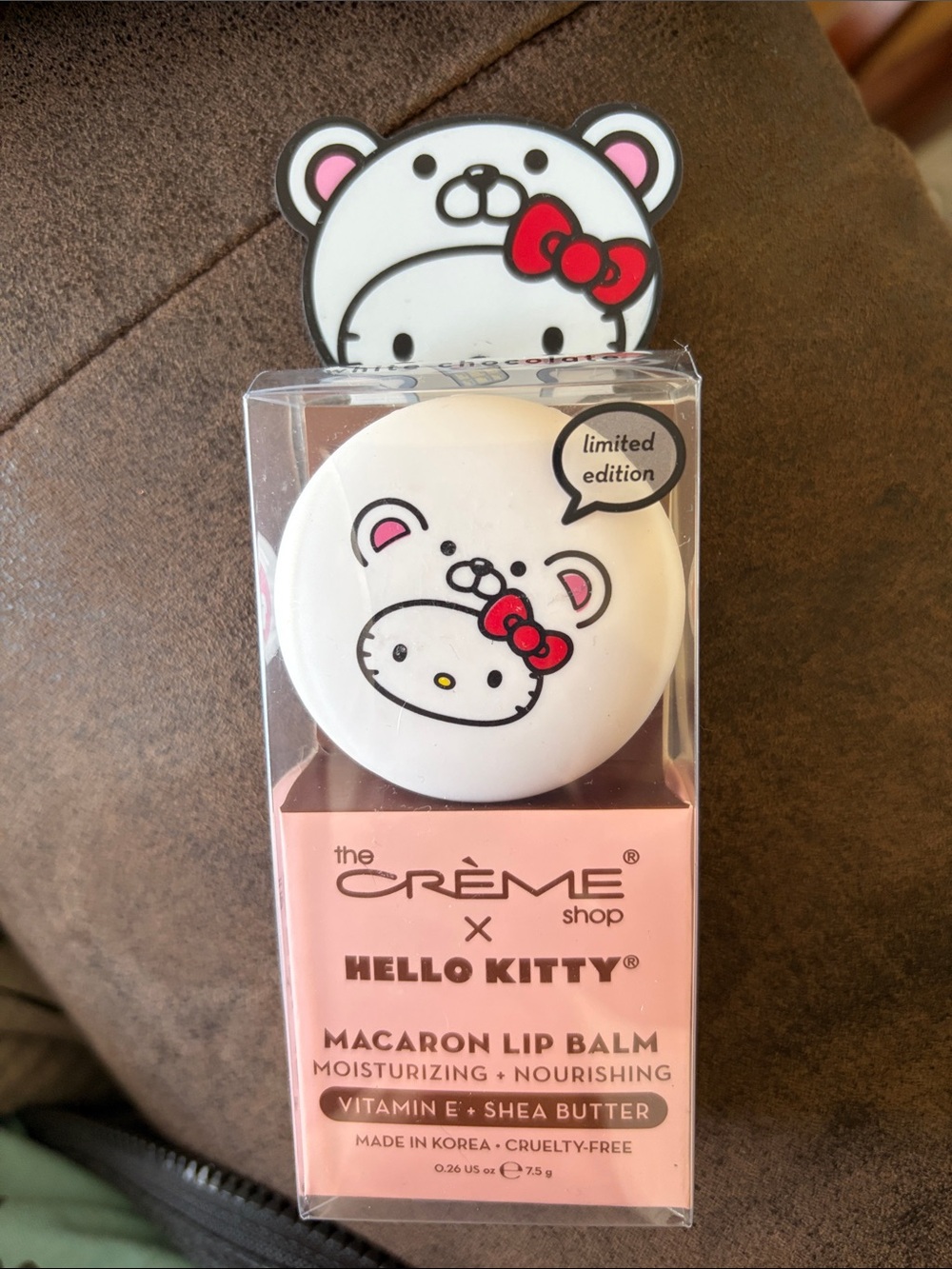 the CRÈME Shop x Hello Kitty Macaron Lip Balm - White & Pink